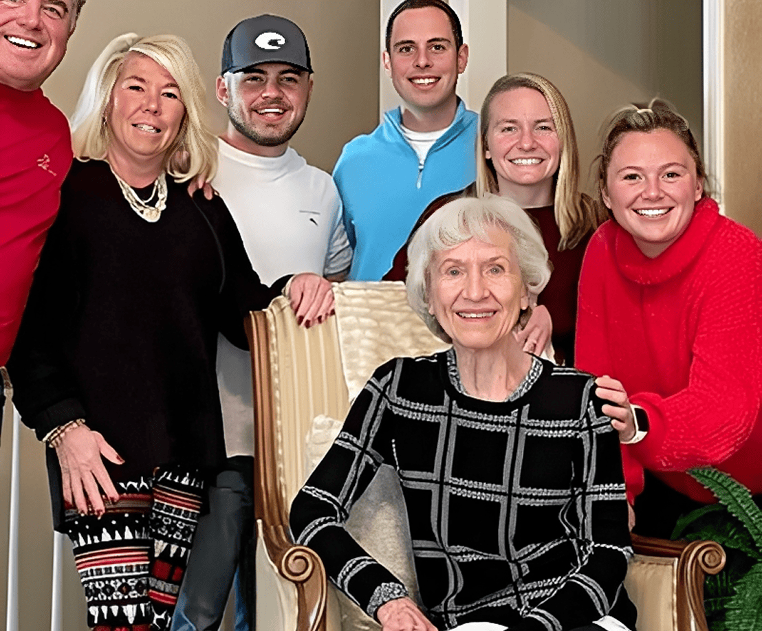 Group photo with an older woman seated.