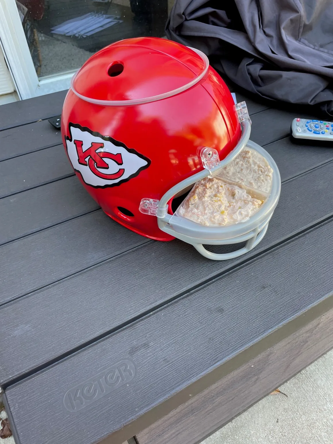 Red football helmet with team logo.