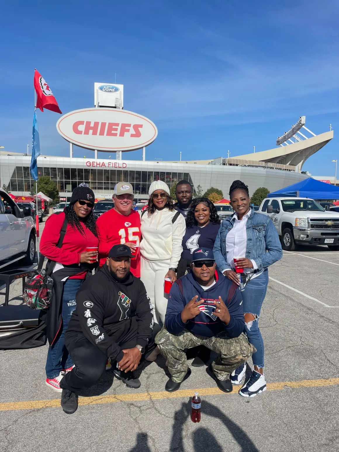 Group tailgating outside Chiefs stadium.