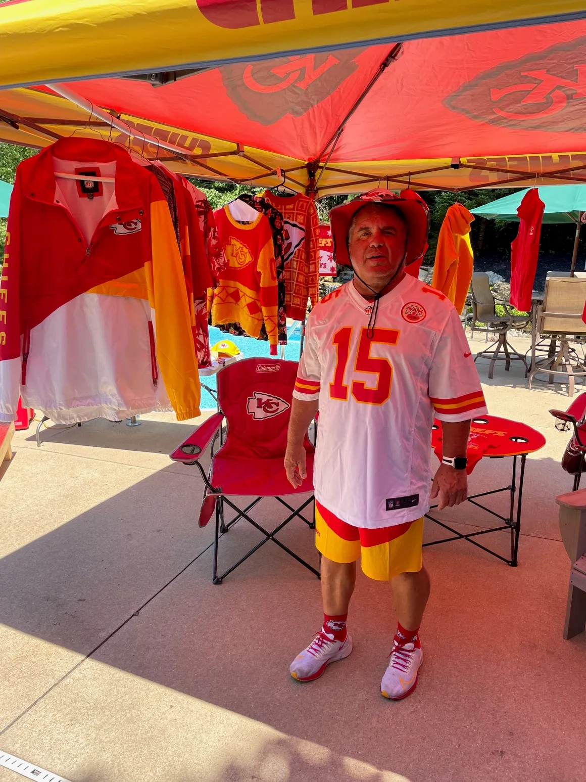 Man in sports gear under a canopy.