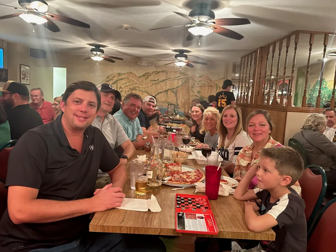 Group dining at a restaurant table.